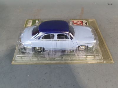 a toy car that is sitting on top of a plastic tray