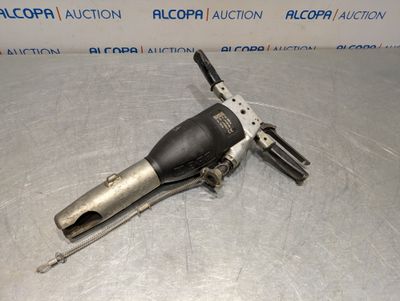 a close up of a metal tool on a table
