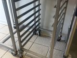 a metal rack that has a bunch of trays on it