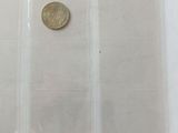 four different types of coins in a plastic bag