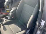 the interior of a car with two seats and a steering wheel