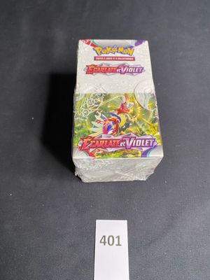 a close up of a box of pokemon trading cards on a table