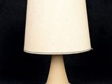 a lamp that is on a table with a black background