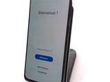 an image of a phone with a blue button on the screen