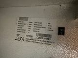 a label on the side of a machine that is sitting on the wall