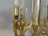 an antique brass chandelier with clear glass drops hanging from it ' s arms