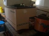 a pile of boxes sitting on top of a table in a room