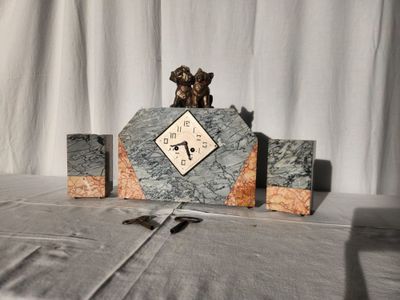 a clock that is sitting on a table with a pair of scissors