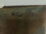 a close up of a metal container with a hole in it