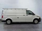 the white van is parked on the concrete floor in the room