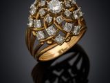 a gold and diamond ring, by business