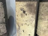 three bottles of wine that are sitting on a table