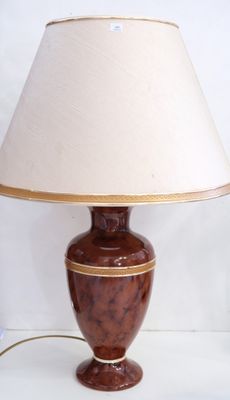 a lamp that is sitting on a table with a lamp on it