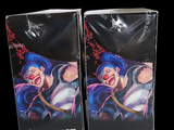 two packages of one piece cigarettes on a black background