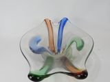 a glass bowl sitting on a table with a white background