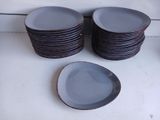 a lot of plates sitting on a counter top