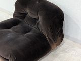 a chair that is sitting in the corner of a room