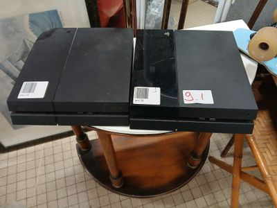 two black boxes sitting on top of each other on a table