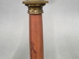 pair of antique brass candlesticks with a red marble base