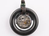 a watch that is sitting on top of a tire