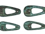four pieces of green patished metal on a white background