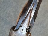 a close up of a gun with a metal handle