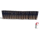a set of twelve books in blue covers with gold lettering