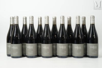 a group of bottles of wine sitting on top of a table