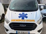 an image of a white van parked in front of a building