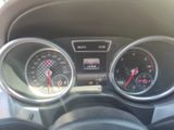 a close up of a car dashboard with gauges and speedometers