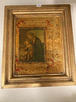 tableau d'une femme tenant un enfant dans un cadre doré