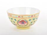 a yellow bowl with a floral design on it