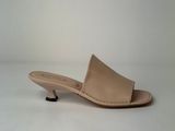 an image of a pair of nude colored shoes on a white background