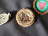 three different items that are sitting on a black cloth