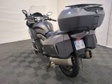 a motorcycle that is parked on a checkered floor