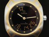 a watch that is on display on a black surface