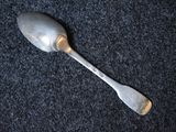 a silver spoon with a silver handle on a black surface