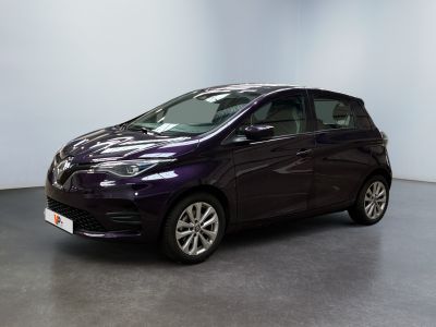 a purple car is parked in a room with a white wall