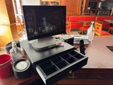 a computer monitor sitting on top of a desk