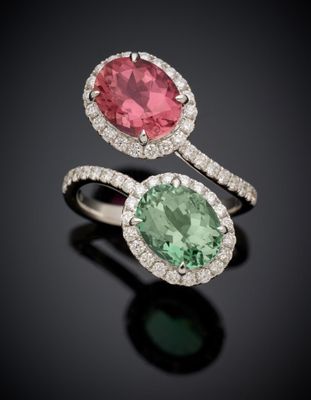 a pair of tourmaline and emerald rings
