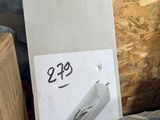a refrigerator that is sitting in a room with a lot of wood