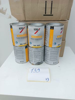 three cans of paint sitting on top of a table next to a cardboard box