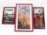 three framed pictures on the wall of a room