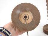 a person holding a wooden object in their hand