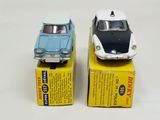 two toy cars that are on top of a box