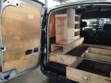 a van that has some drawers inside of it
