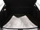 the back of a truck with the bed folded down and the cargo tray open