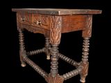an old wooden table with a drawer on the top and a drawer on the bottom