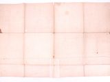 a close up of a piece of paper on a white surface
