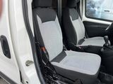 two seats in the back of a white van